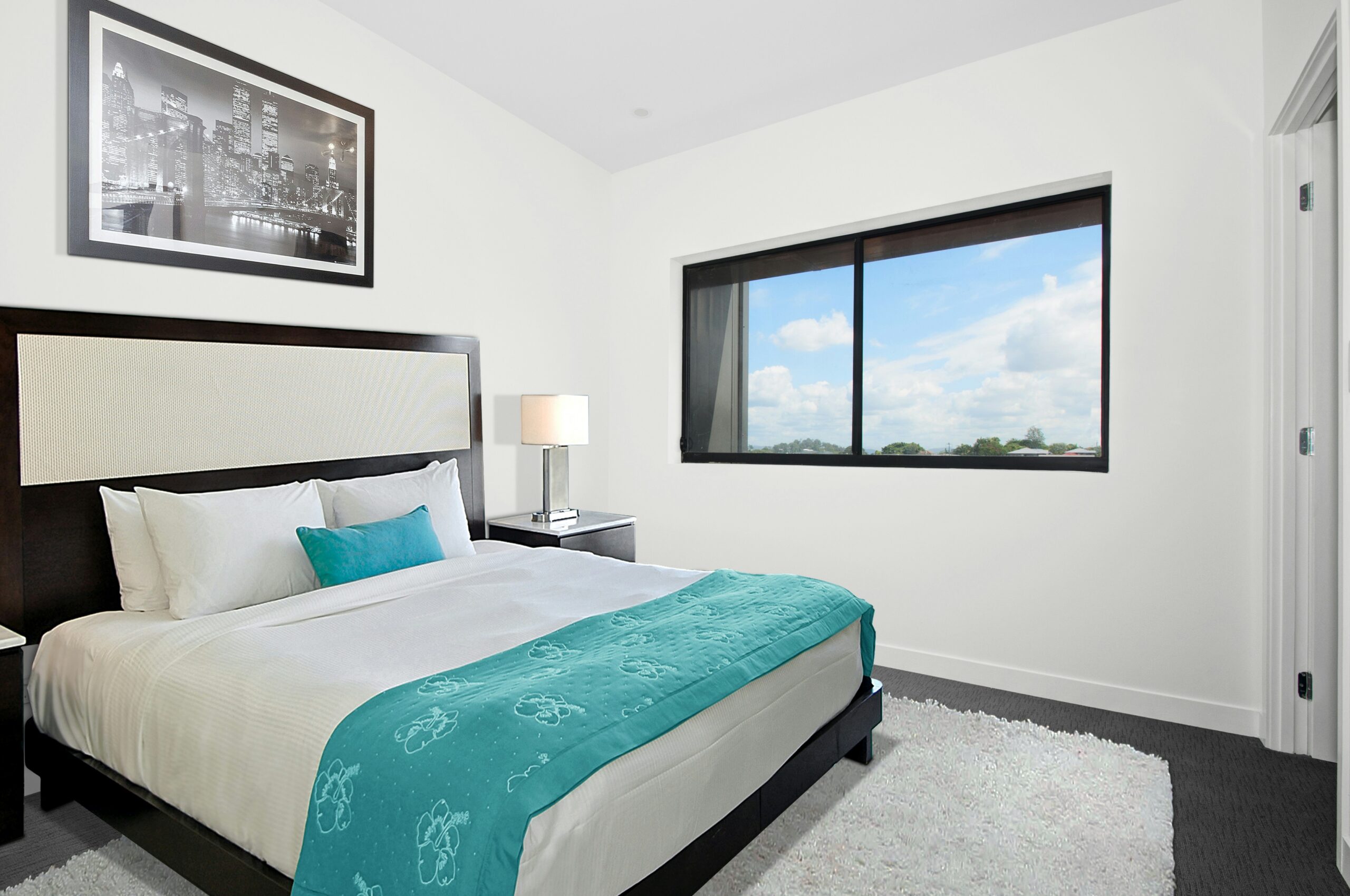 luxurious bedroom with double bed and big windows