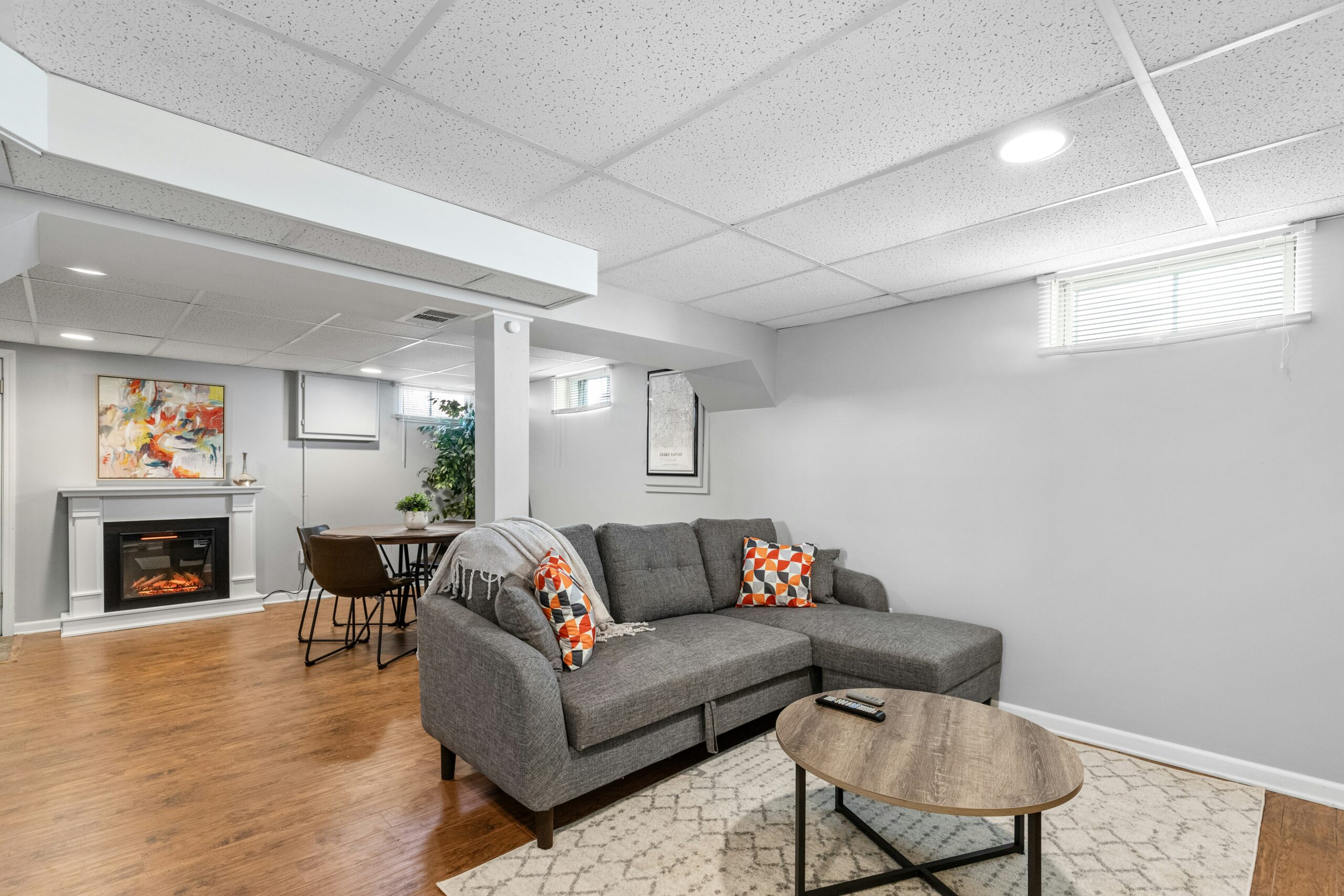 spacious and luxurious living room with a foldable couch and large windows