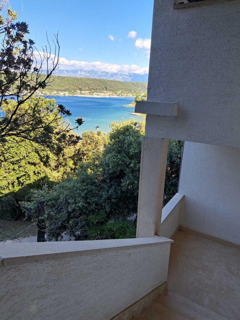 view of the sea from the stairs in our rentals